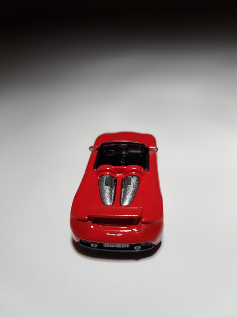 Illustration for article titled Makeitfit Monday: Rennsport Reunion Edition - Malibu International 1:87 Porsche Carrera GT